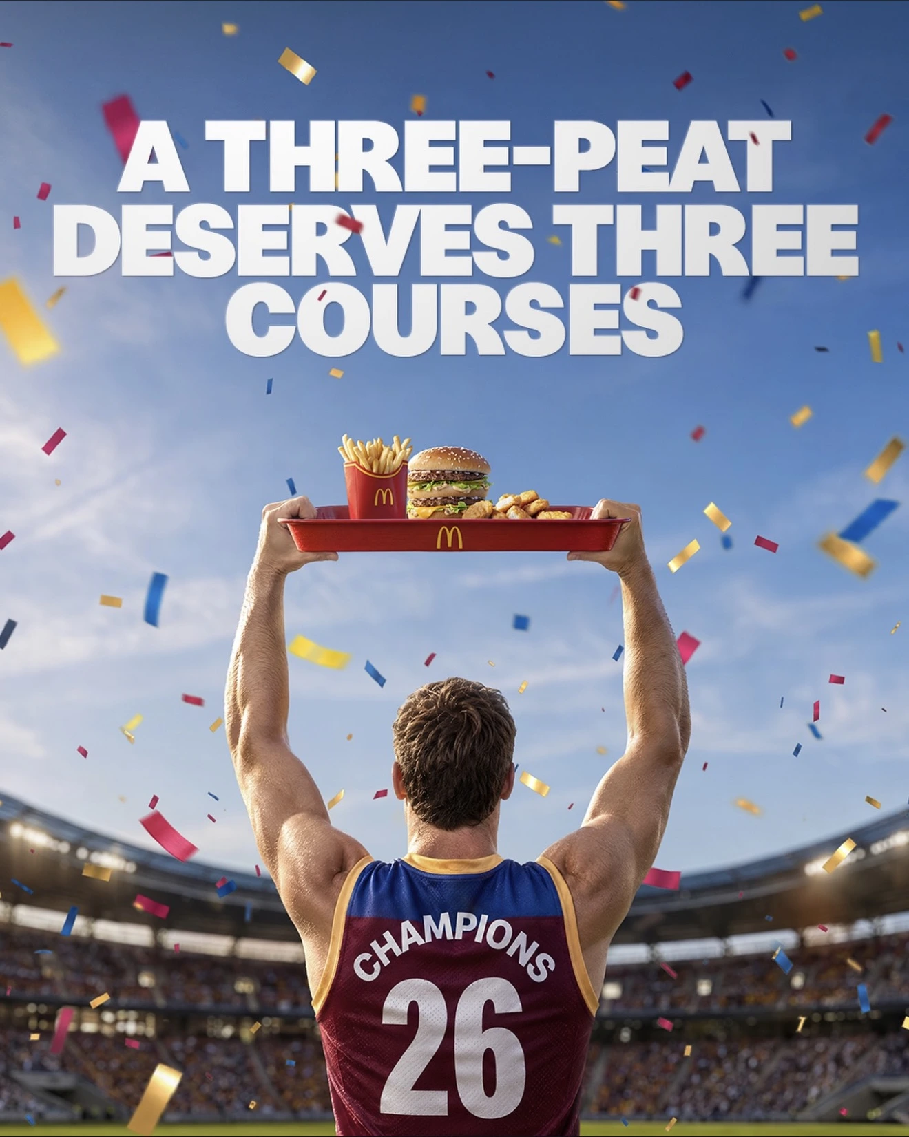 A footy champion raises a McDonald's tray under falling confetti