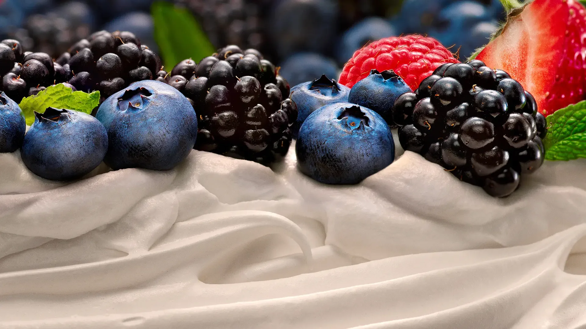 Christmas pavlova topped with blueberries, blackberries and strawberries