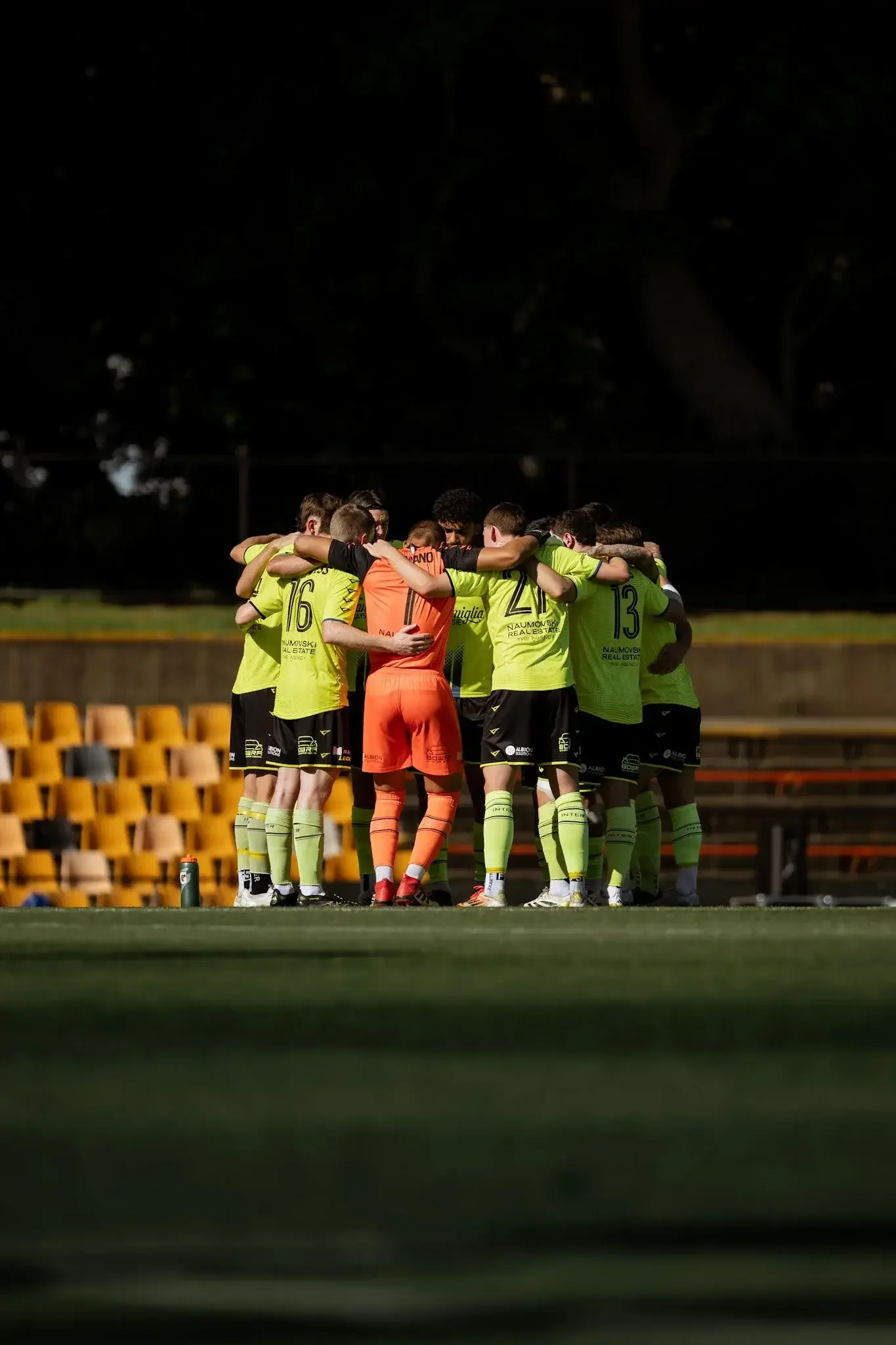 Team huddle on the pitch
