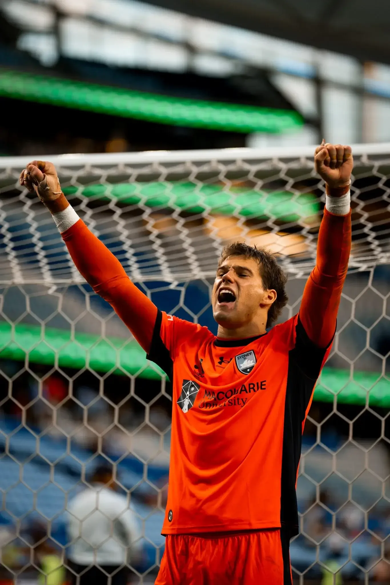 Goalkeeper celebrates at the net