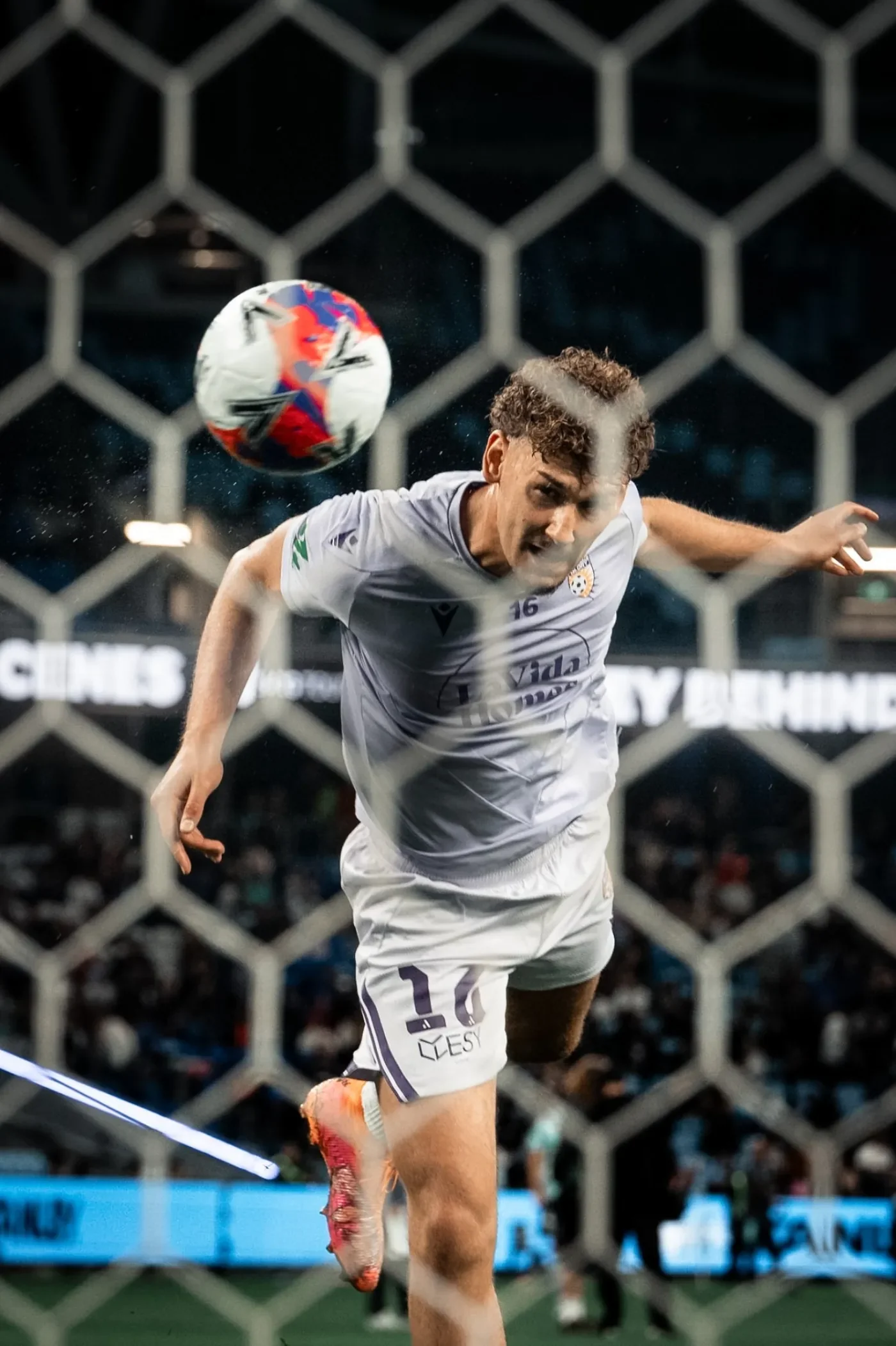 Goalkeeper rises to the ball