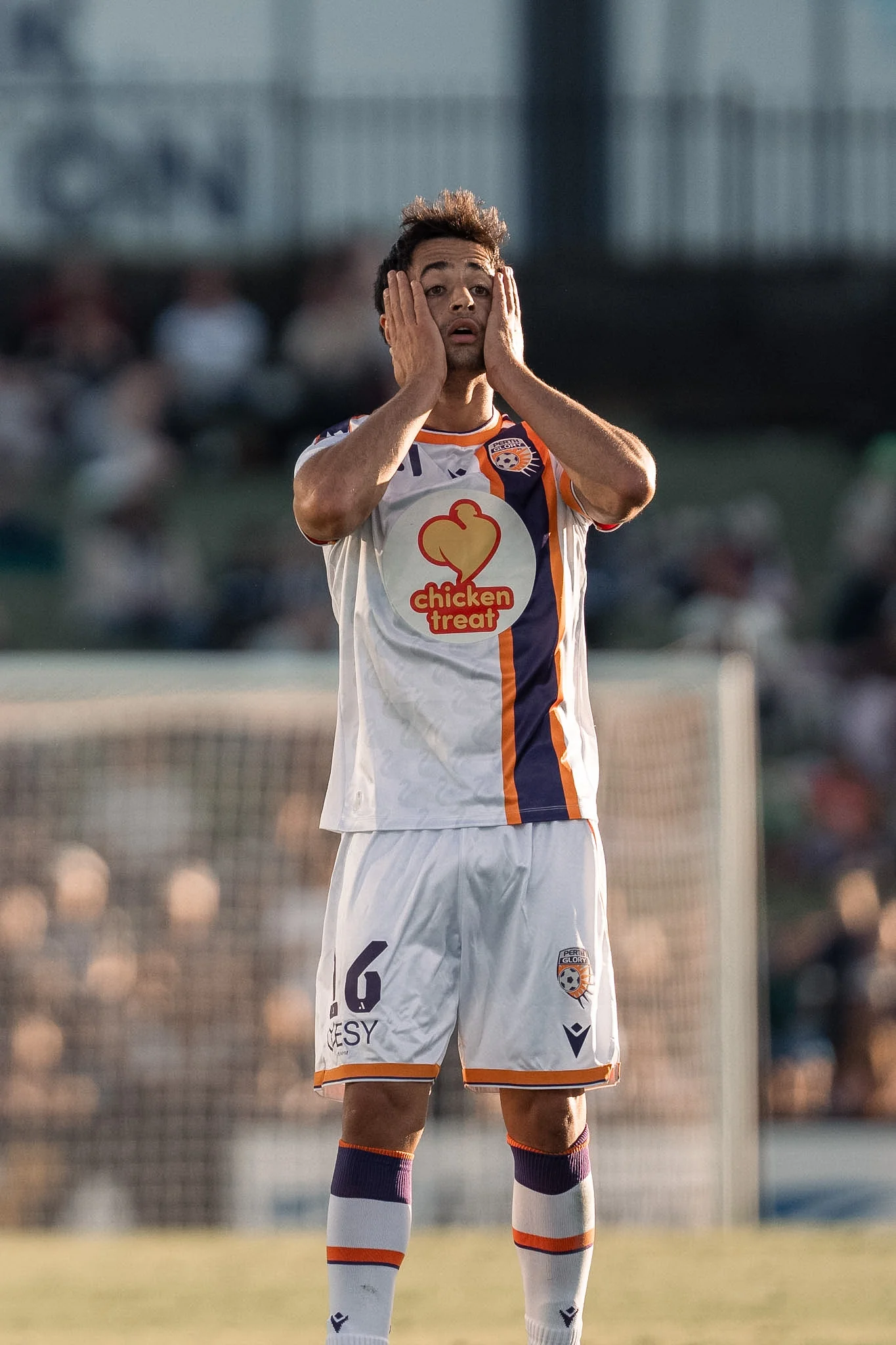 A player applauds the supporters