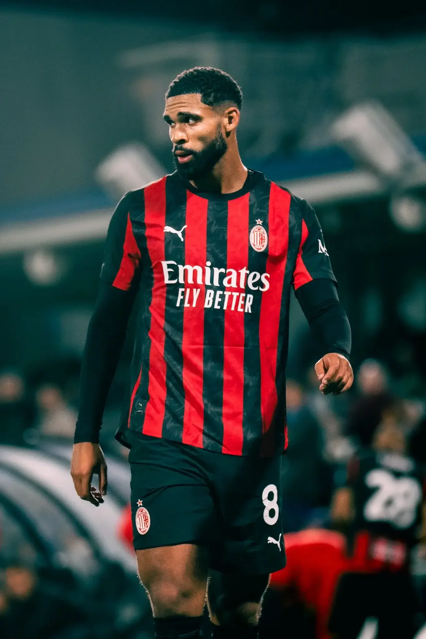 Player in a red and black striped shirt